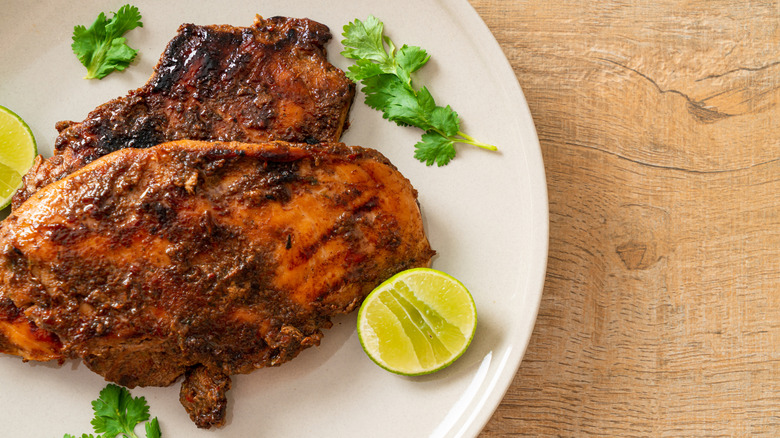 Overhead view of jerk chicken on plate