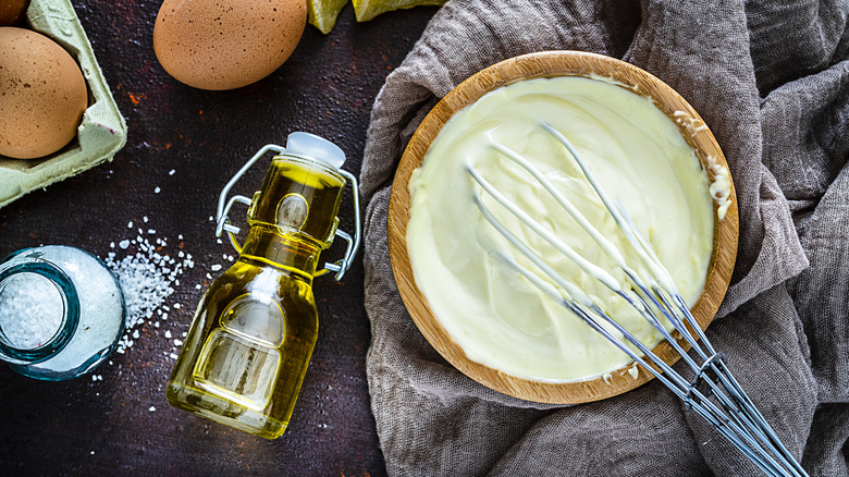Whisk preparing homemade mayonnaise from natural ingredients