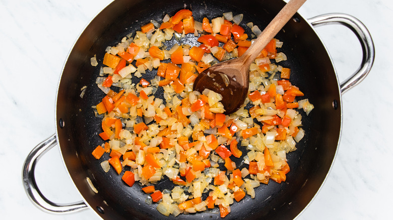 onions and pepper in a pan