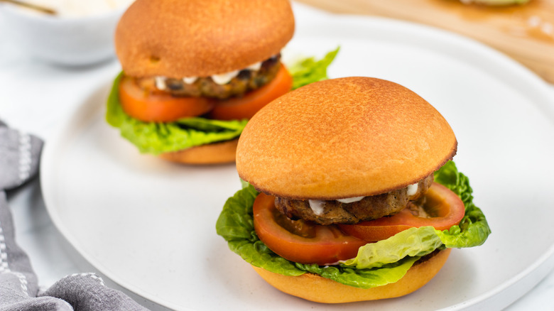 two turkey burgers on plate