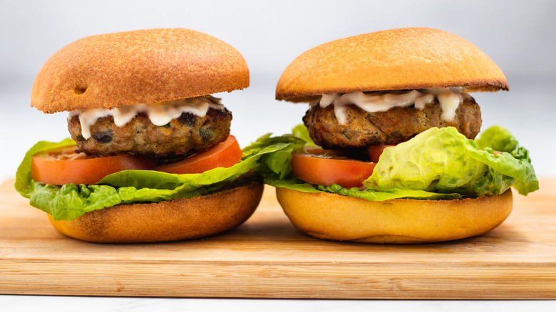 side view of 2 burgers