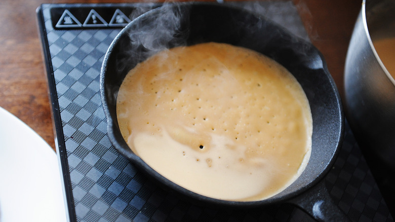 Cooking pancake on cast iron