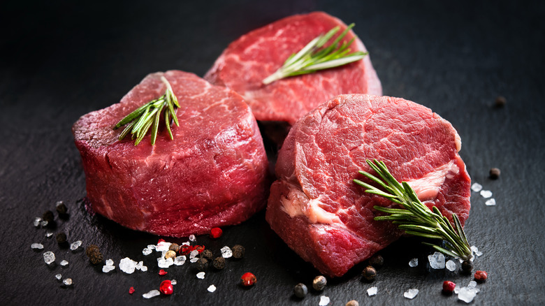 A trio of raw filet mignon