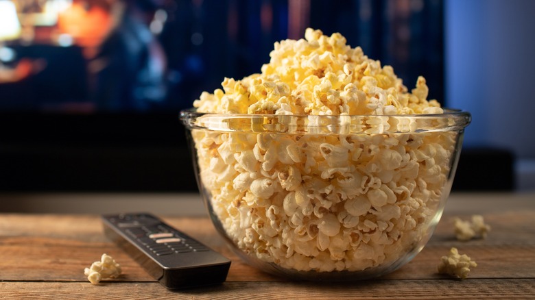 Bowl of popcorn and remote