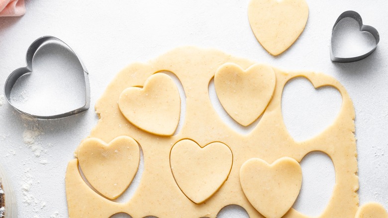 Cookie cutters and dough 