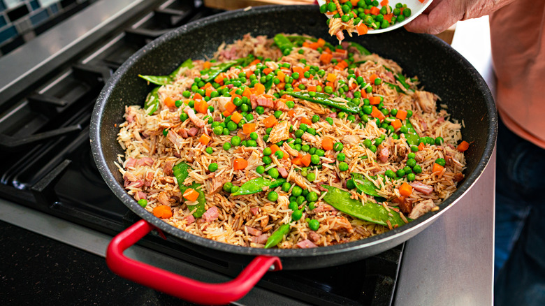 fried rice in a skillet on the stove