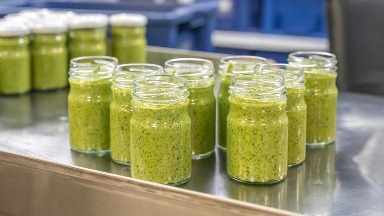 Pesto jars on assembly line