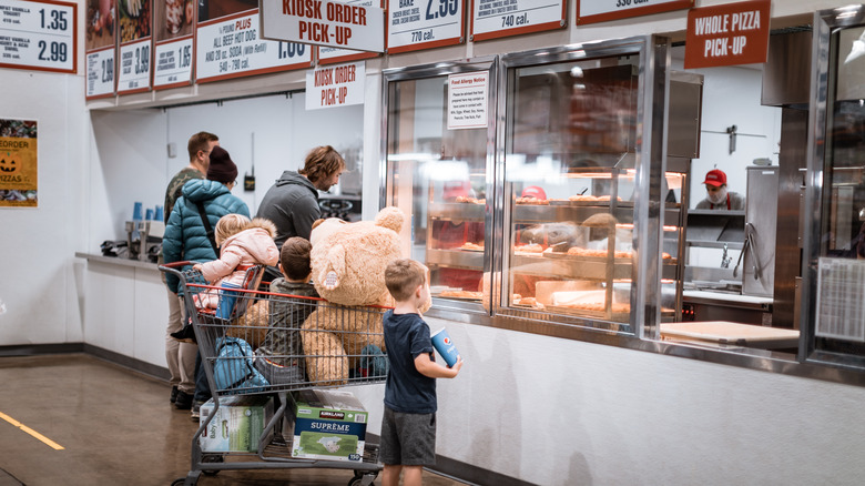 family lined up as a costco food court