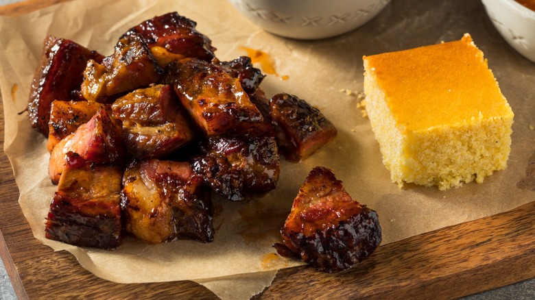 Closeup of brisket burnt ends with cornbread