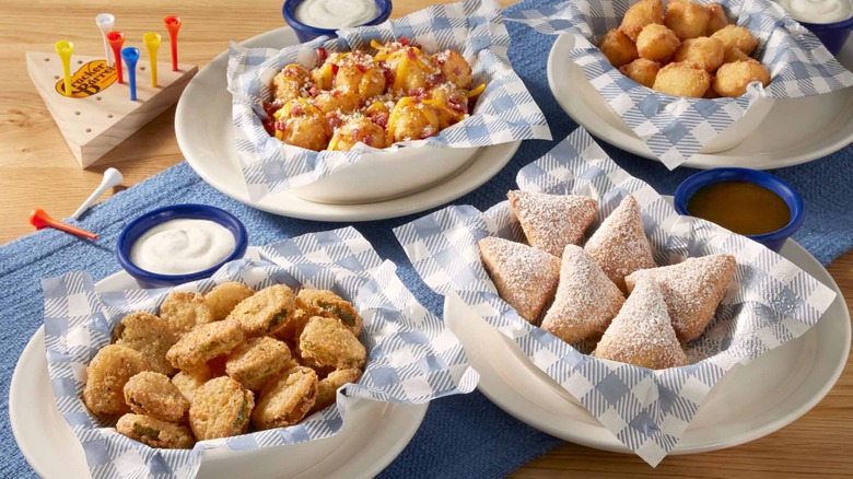 Variety of Cracker Barrel appetizers on a table with peg game