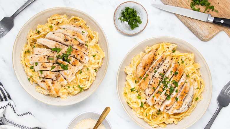 chicken Alfredo pasta in bowls