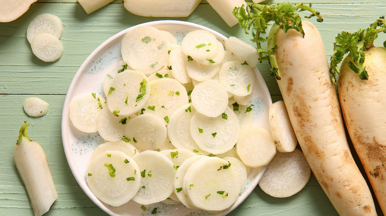 Produce crate filled with daikon radishes