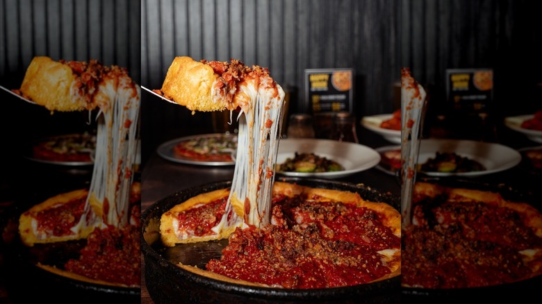 rows and stacks of a grocery store freezer aisle with Gino's East deep dish pizza