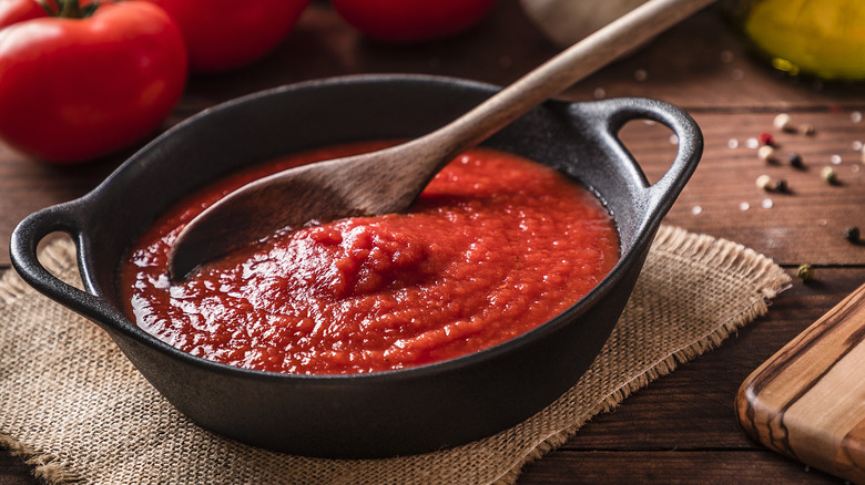pasta sauce in a pot with wooden spoon