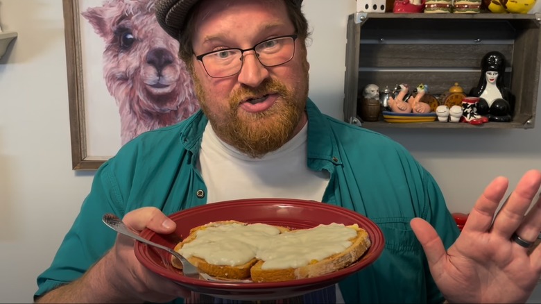A man holding a plate of milk toast