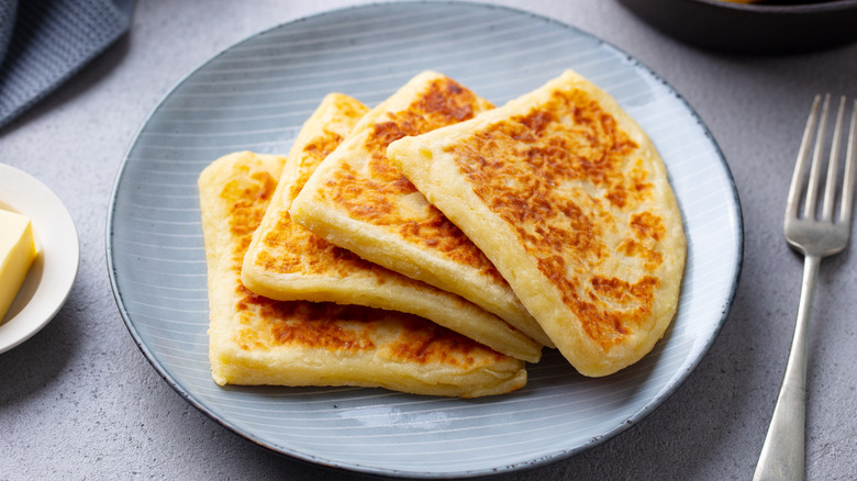 Potato scones on a plate, cut into quarters