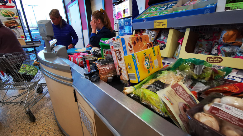 Aldi cashier at checkout line 