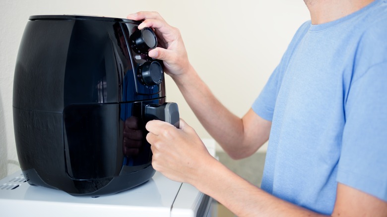 Turning on air fryer