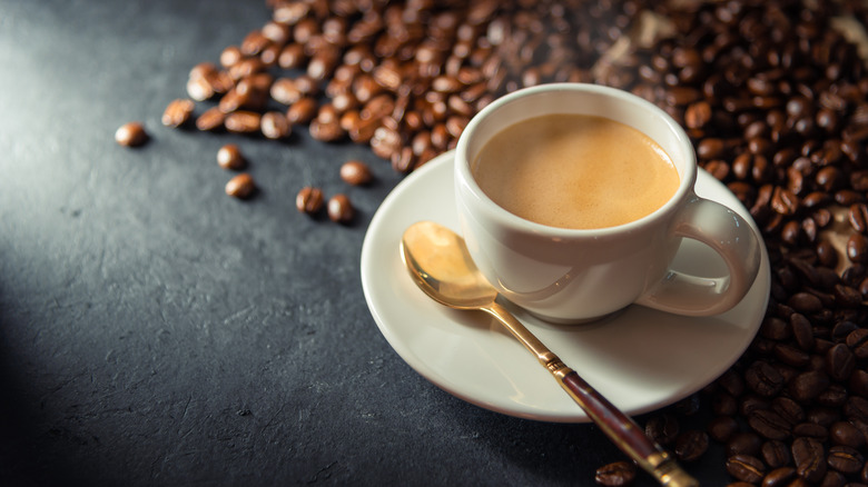 cup of coffee with coffee beans