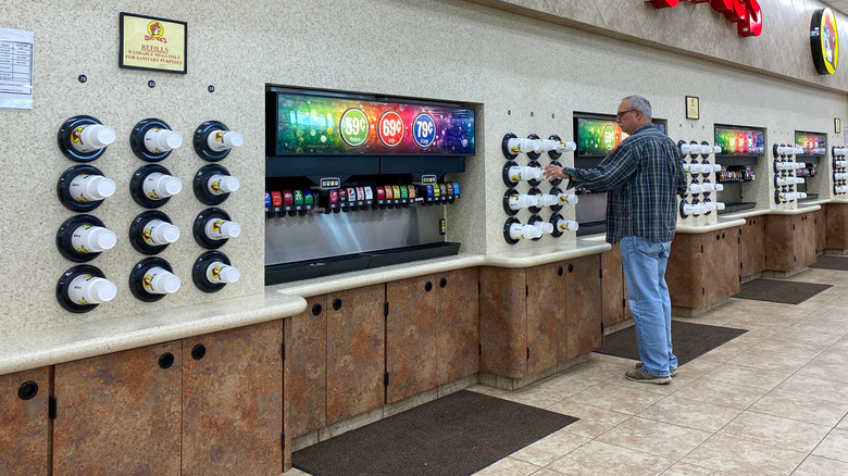 Person at Buc-ee's soda station