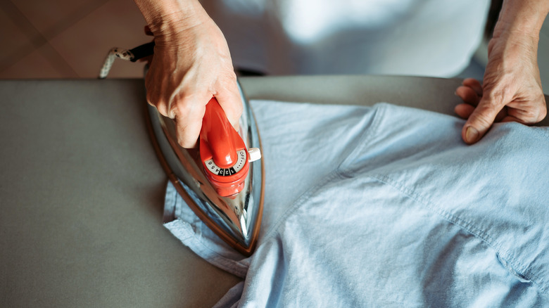 Woman ironing shirt