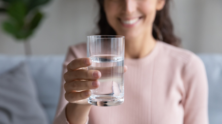 Woman with glass of water