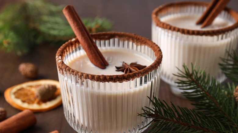 Glass of eggnog with cinnamon stick