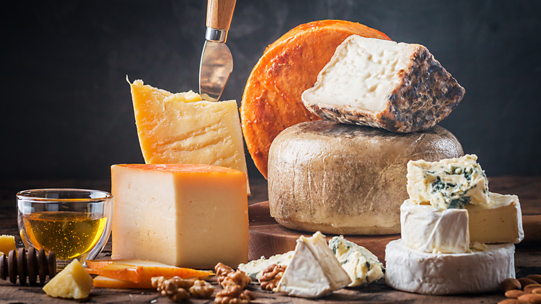 assortment of cheeses on board