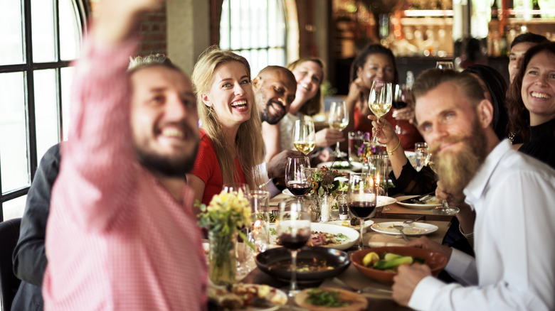 dining with a large group at a restaurant