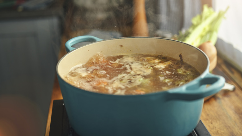 Pot of chicken soup on the stove