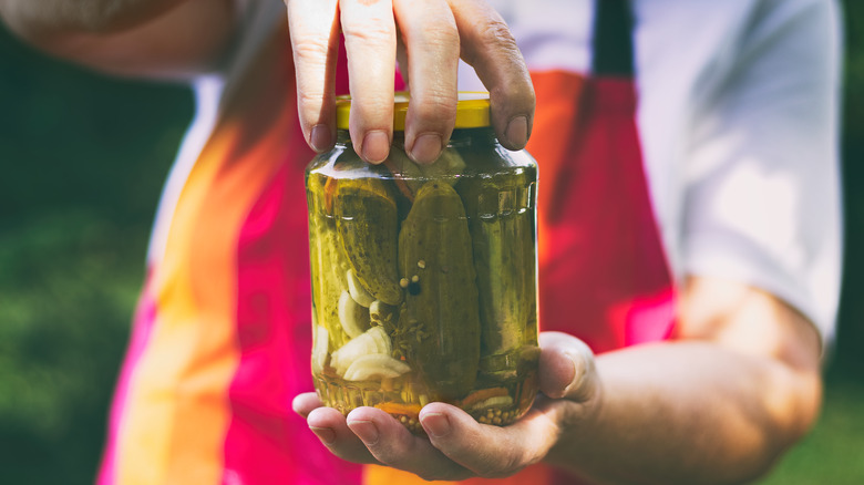 pickle jar in two hands