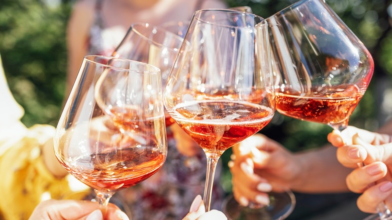 hands holding sparkling wine