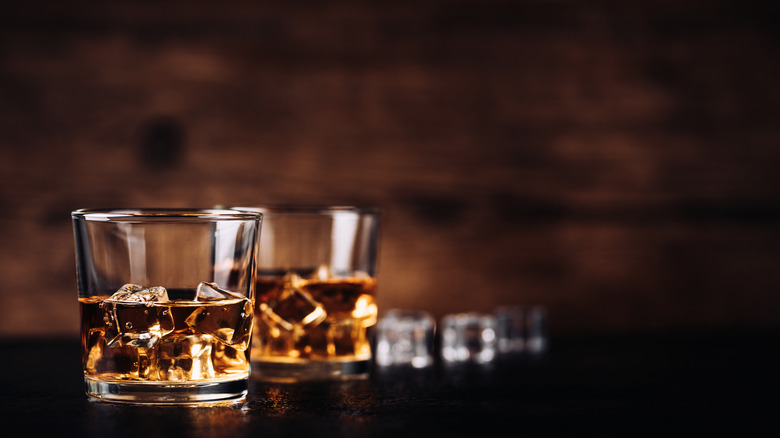 Two glasses of bourbon on ice