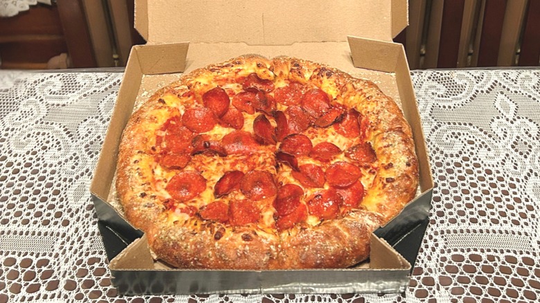 Close up view of a Domino's pizza inside the box