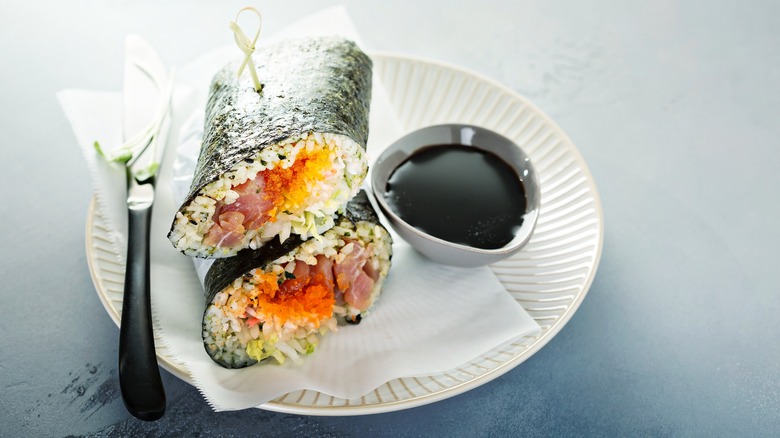 nori sushi burrito stacked on plate