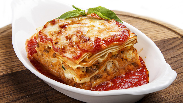 Lasagna dish on wooden board