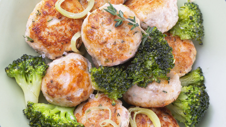 Plate of salmon meatballs and broccoli