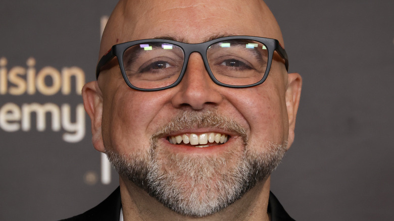 Duff Goldman wearing glasses smiling