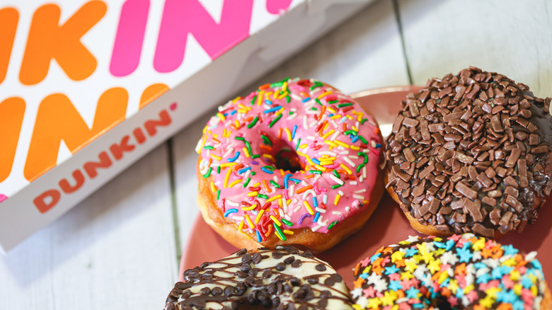 Donuts next to Dunkin' box