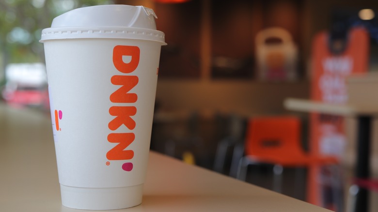Dunkin' coffee cup on table