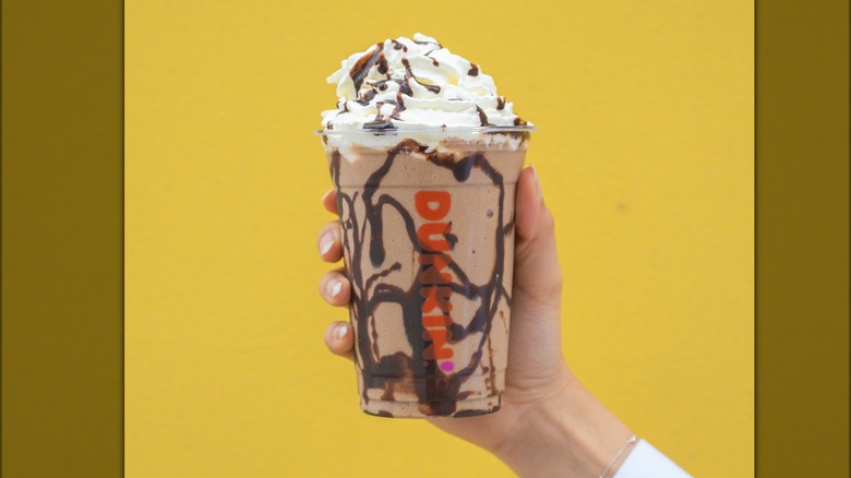 hand holding frozen Dunkaccino