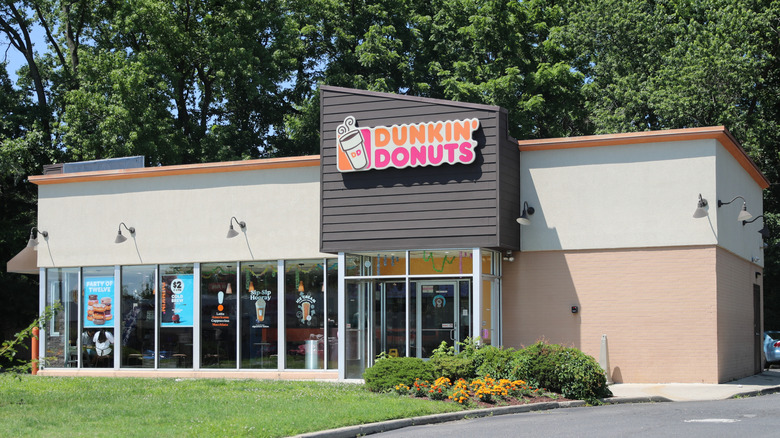 Dunkin' location surrounded by greenery