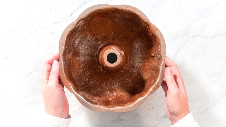 Bundt pan dusted in cocoa powder 