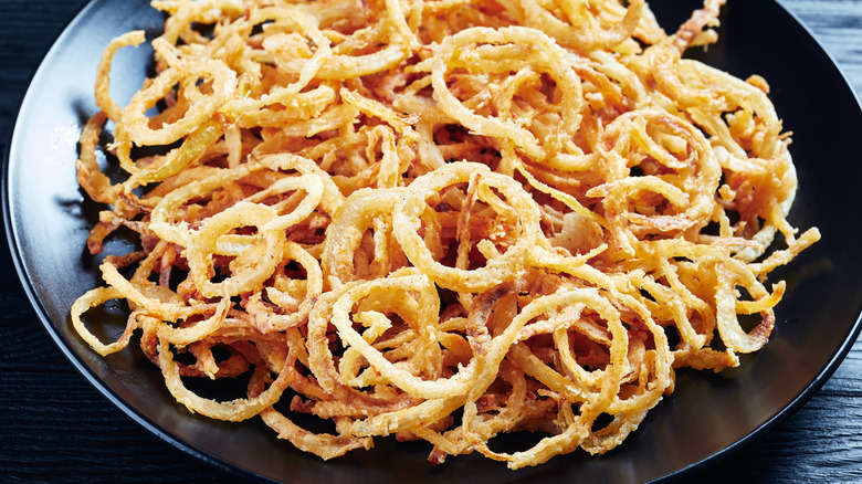 A plate of crispy fried onions