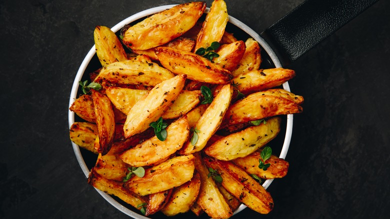 Wedge fries on black background