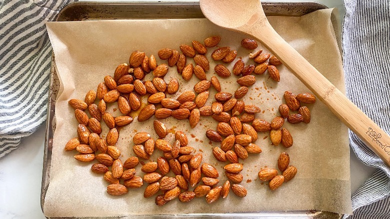 roasted almonds on baking sheet