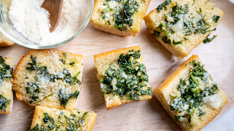 cut garlic bread on board 