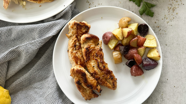 lemon chicken on side of roasted potatoes