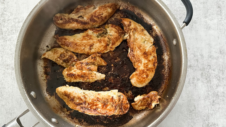 chicken tenderloins seared in skillet