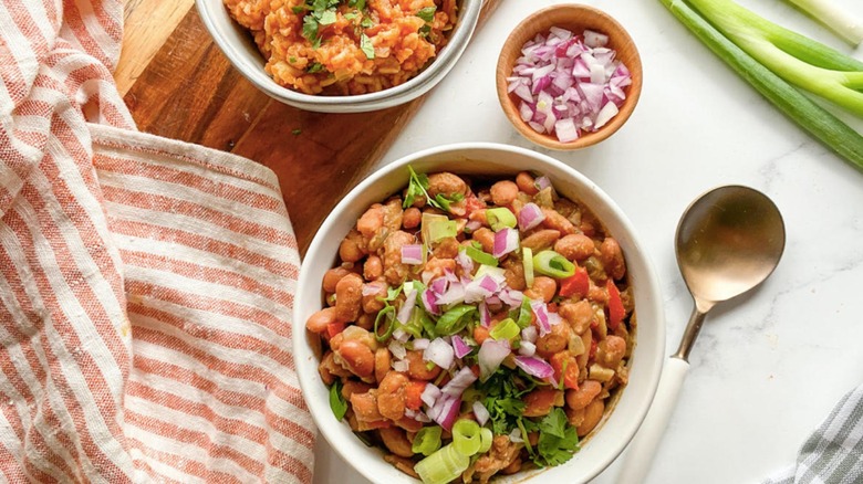 pinto beans topped with red onion